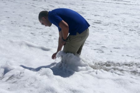 Dr. Justin Perrault, director of research at Loggerhead Marinelife Center, taking a water sample at Juno Beach, FL.