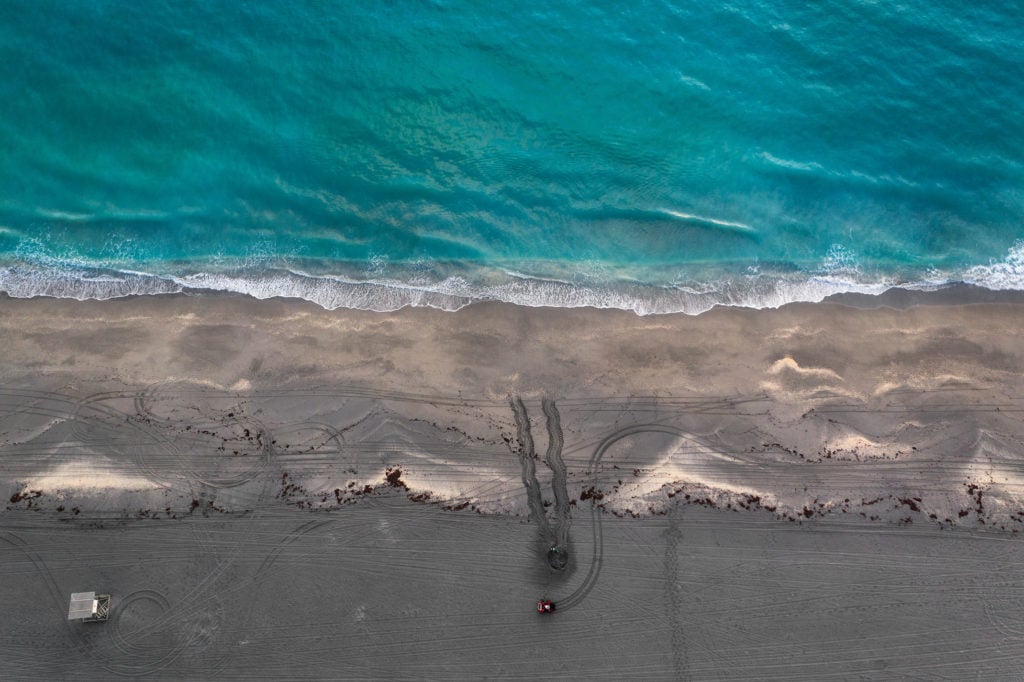 A drone shot of Loggerhead Marinelife Center's research team documenting a newly laid sea turtle nest.